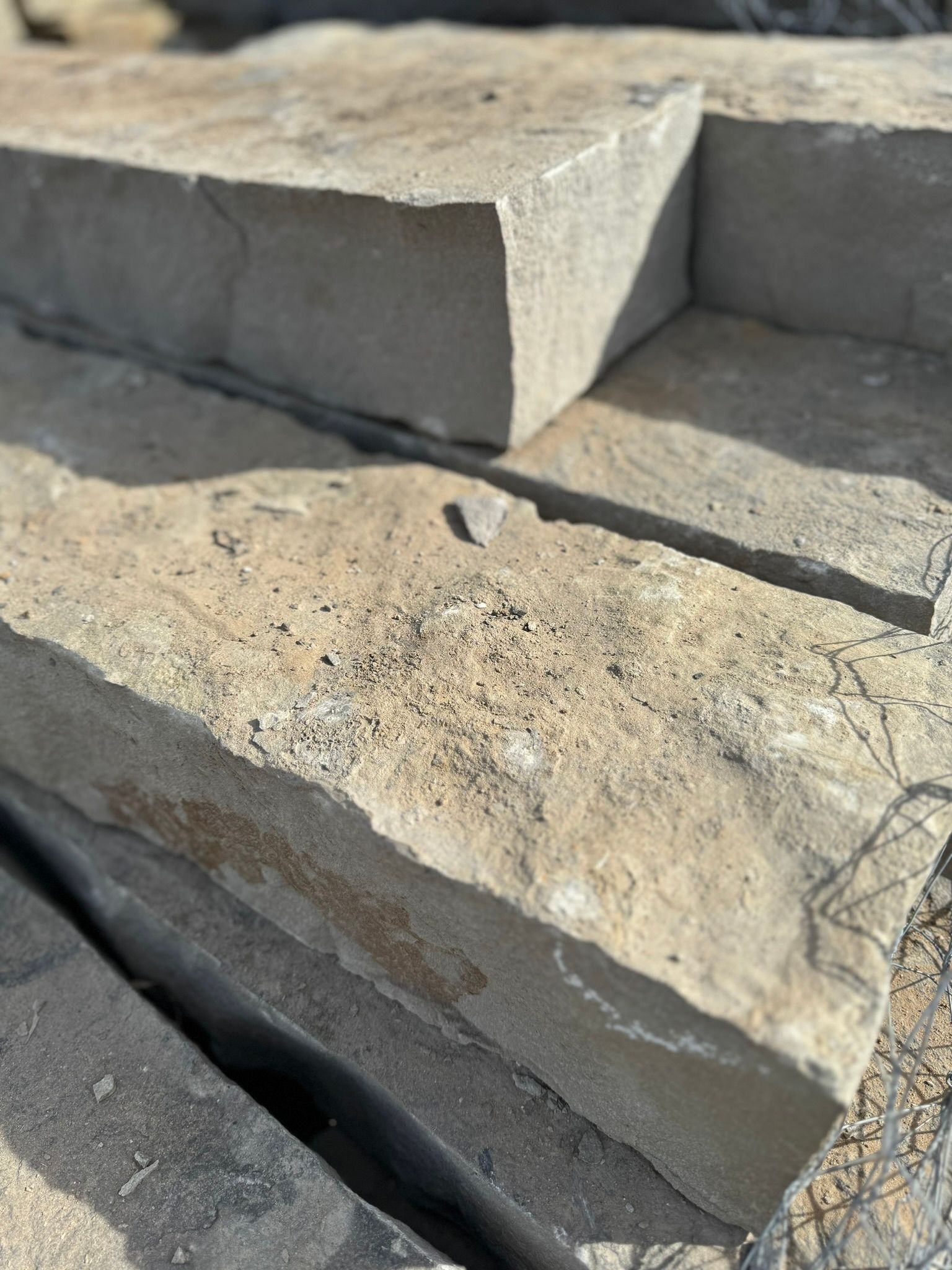 A close up of a pile of bricks sitting on top of each other.