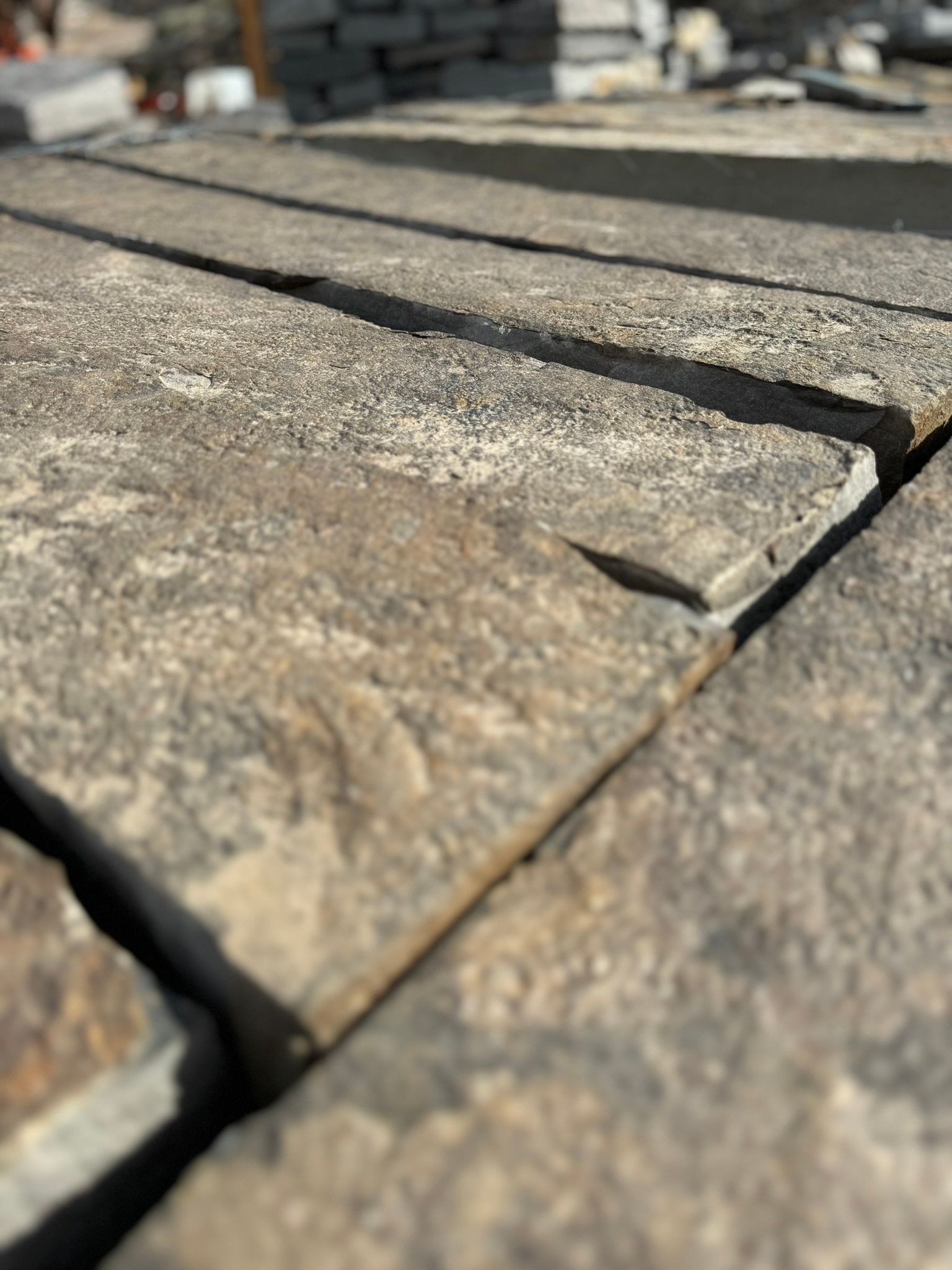 A close up of a pile of bricks on a roof.