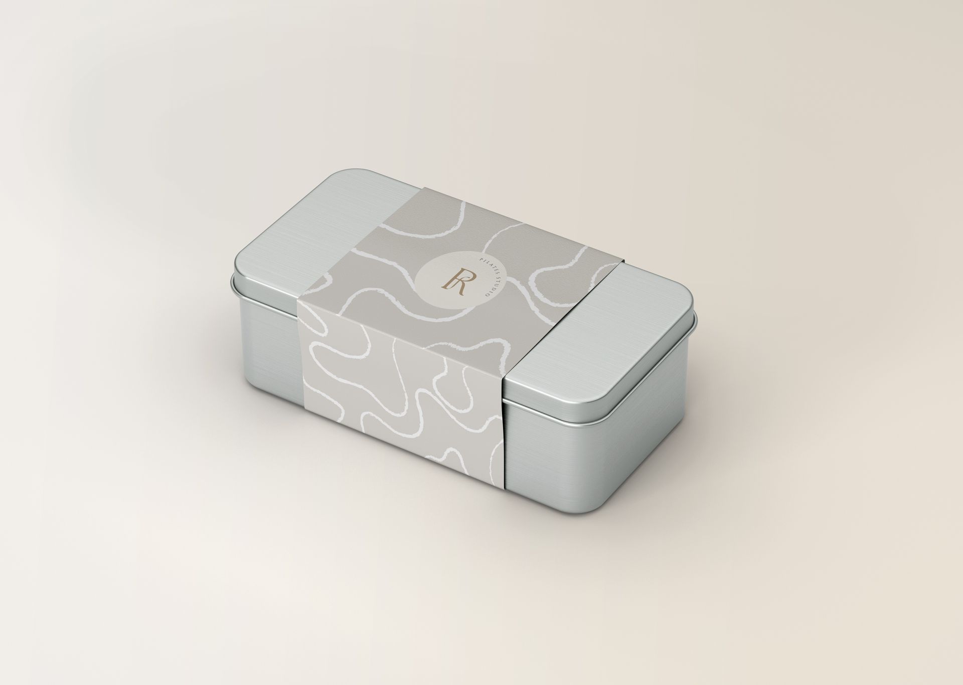 Caja rectangular gris con tapa estampada, mostrada sobre un fondo claro.