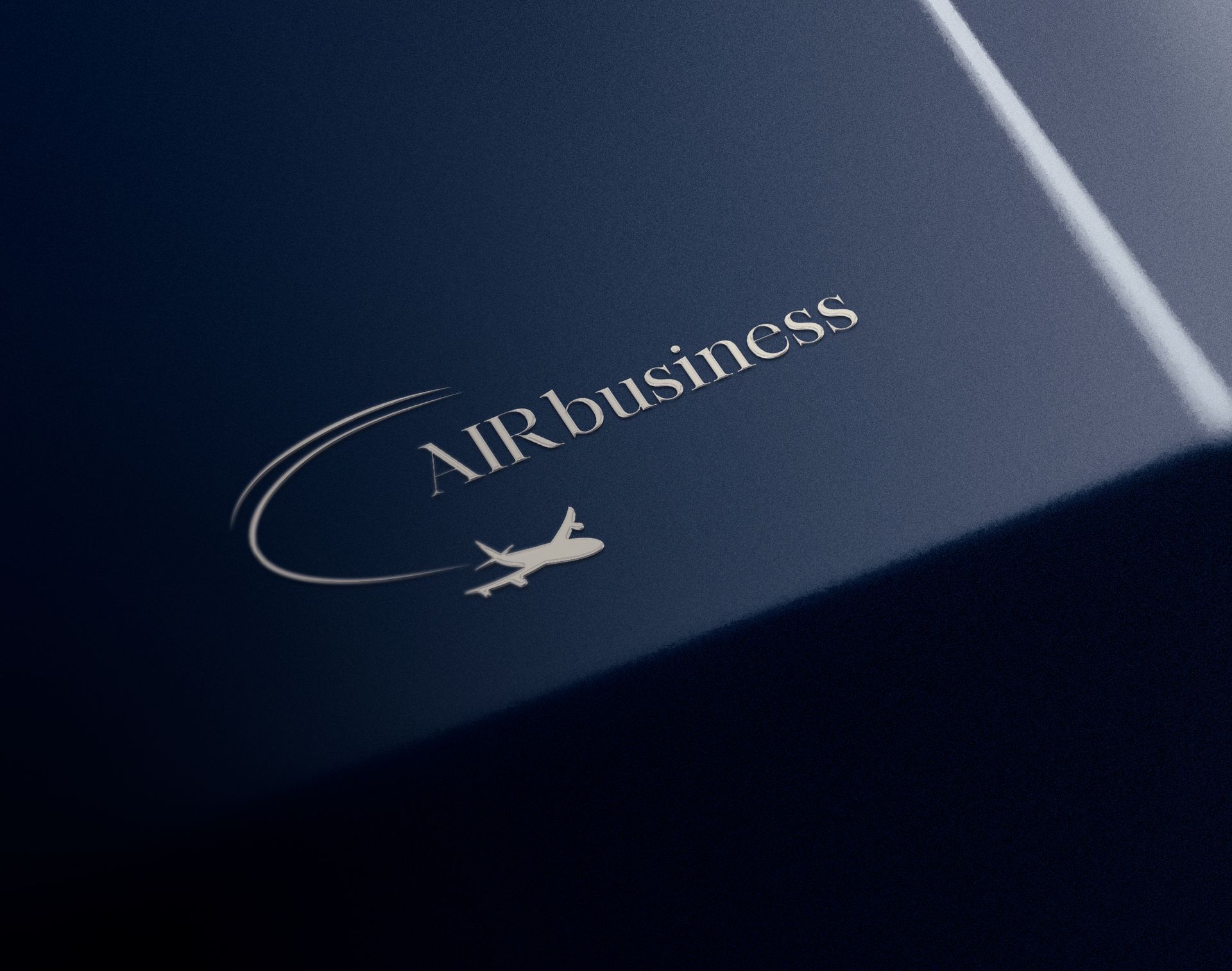 Primer plano de una tarjeta de presentación azul oscuro con logotipo blanco y emblema de pájaro.