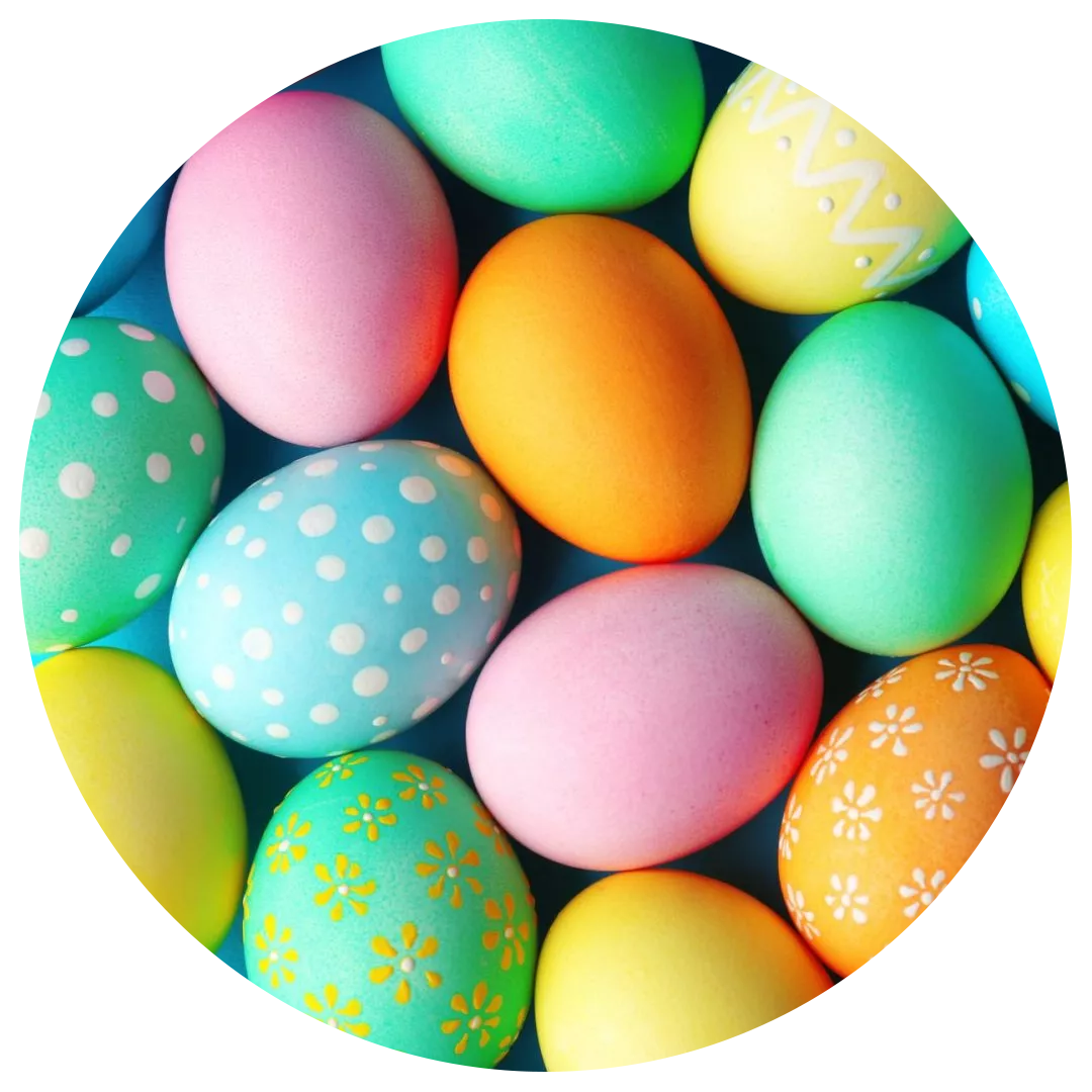 Colorful Easter eggs in various pastel hues, some decorated, arranged together.