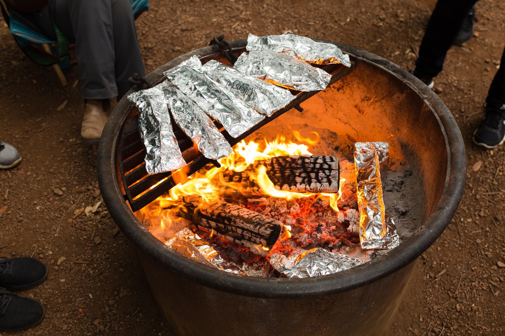 A fire pit with aluminum foil on top of it