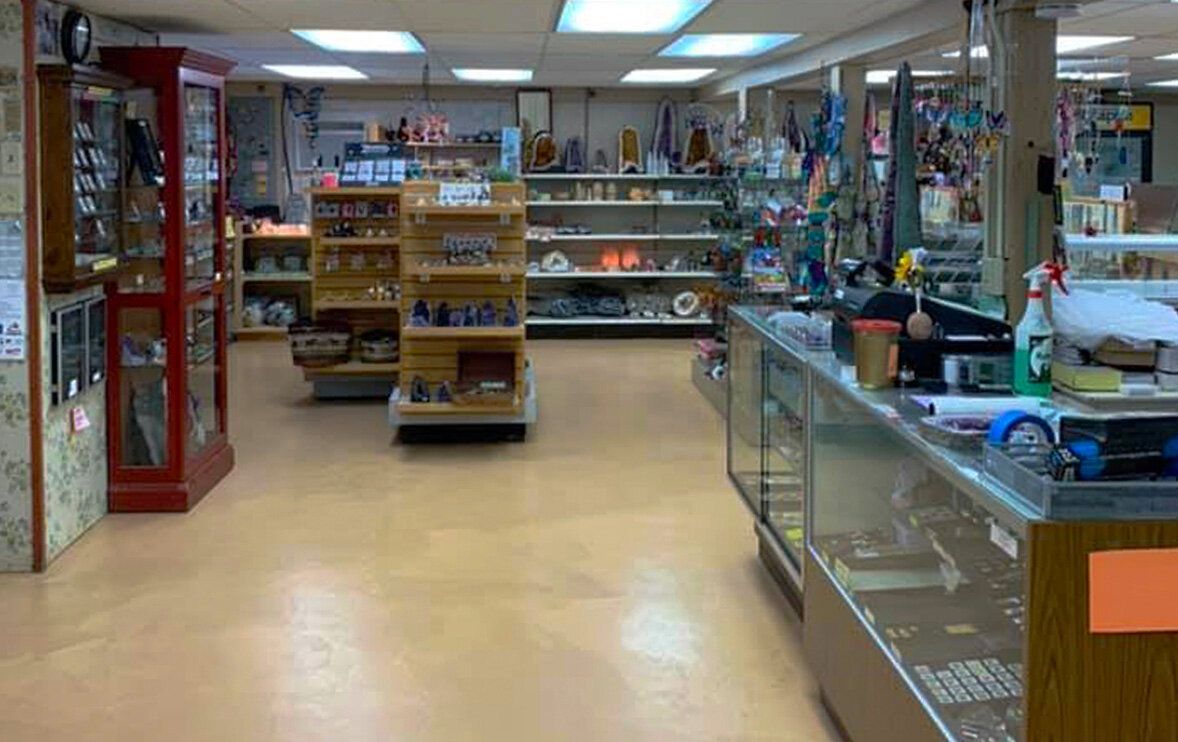 A store filled with lots of shelves and a counter.