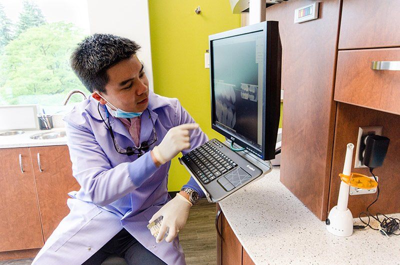 Dr. Jonathan Yeung Looking At A Digital X-Ray