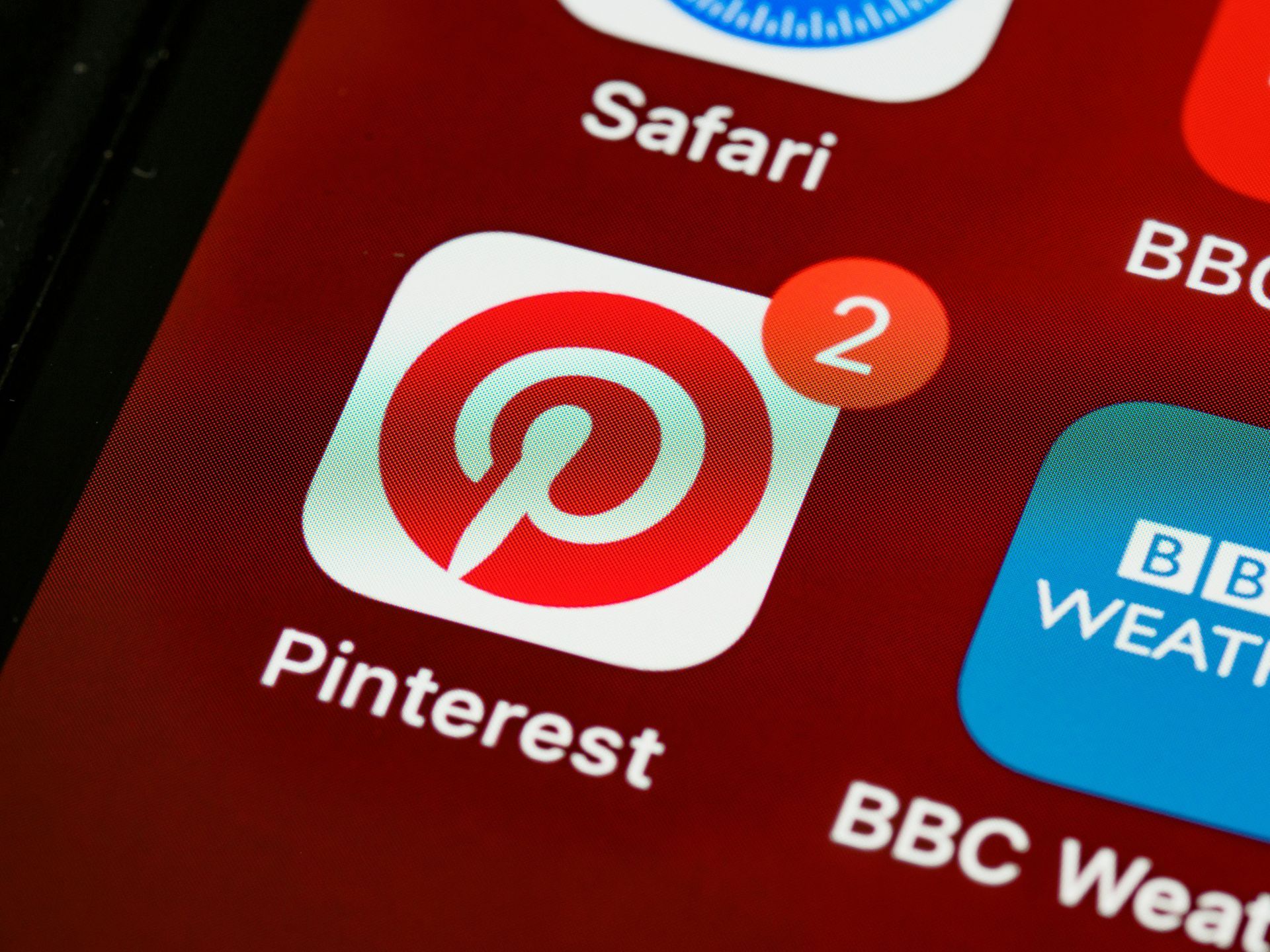 A close up of the pinterest app on a phone