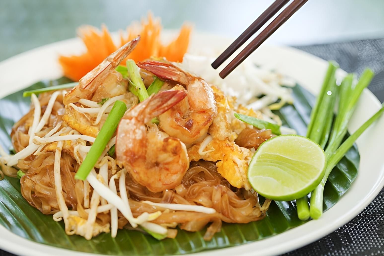 A Close Up Of A Plate Of Food With Chopsticks On It — Mod Thai Nelson Bay In Nelson Bay, NSW
