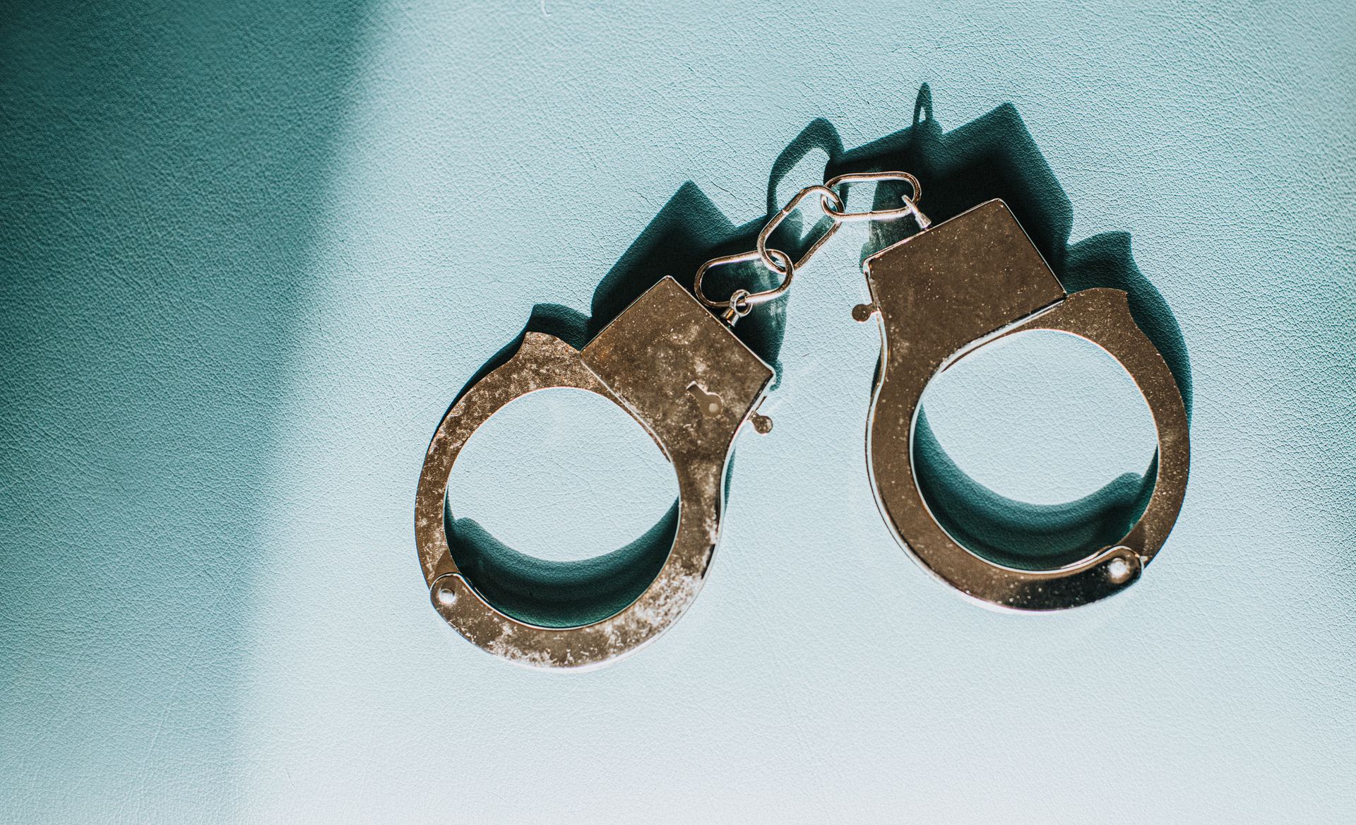 Pair of silver handcuffs.