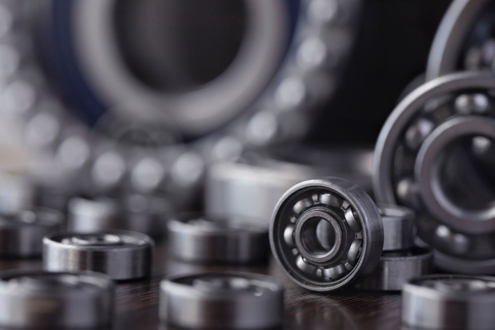 A Bunch of Bearings Are Sitting on a Table — Ballina Bearing Supplies In Tweed Heads, NSW