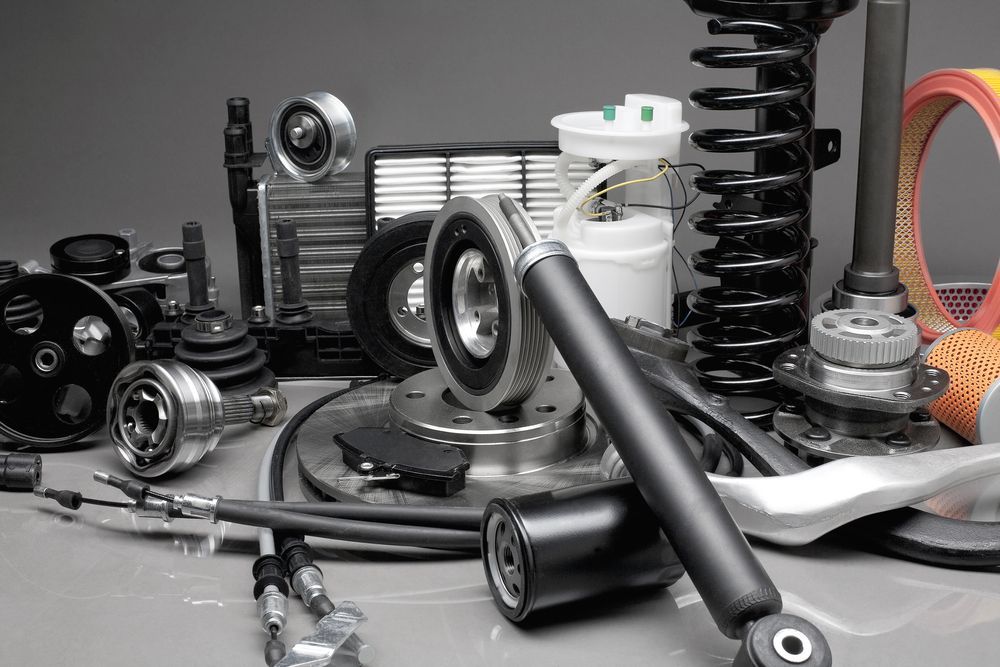 A Bunch of Car Parts Are Sitting on a Table — Ballina Bearing Supplies In Grafton, NSW