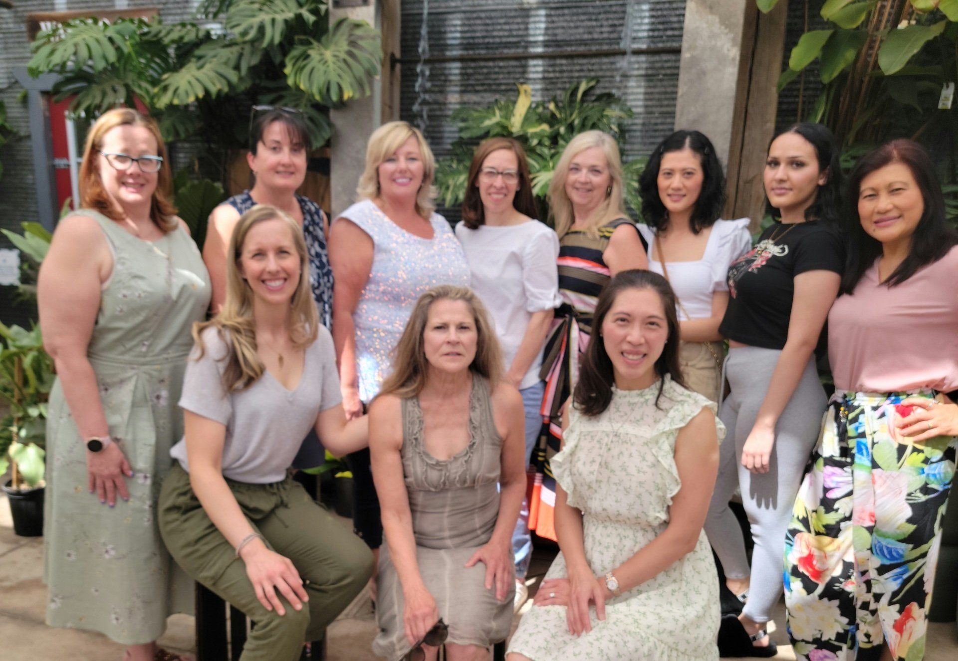 a group of women are posing for a picture together .