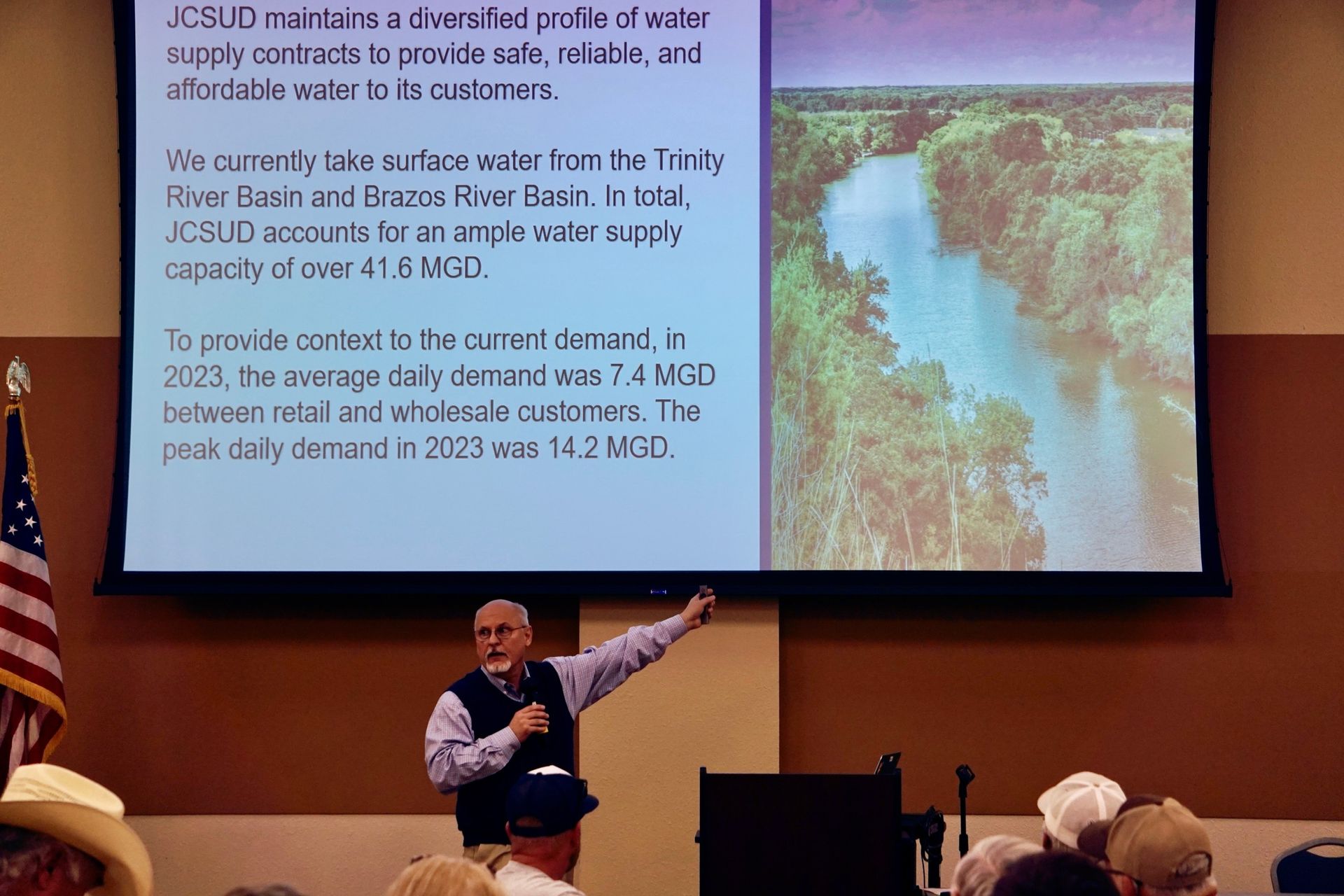 A man is giving a presentation to a group of people