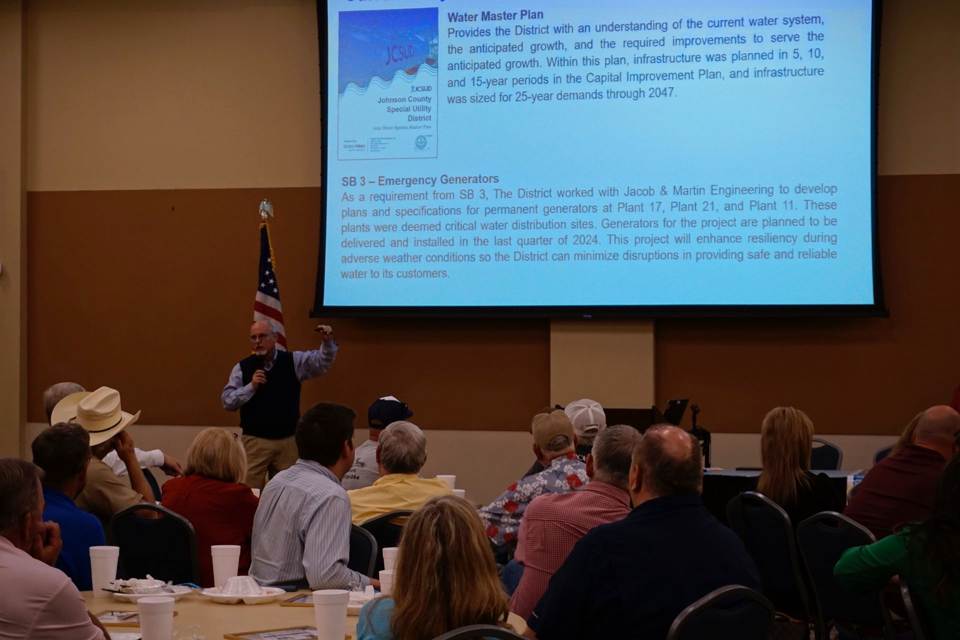 A man is giving a presentation to a group of people