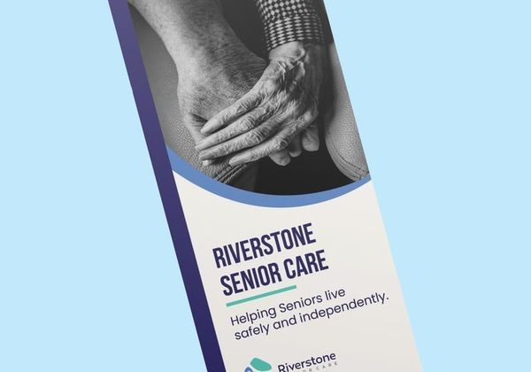 Riverstone Senior Care brochure with black-and-white hands and blue diagonal accents