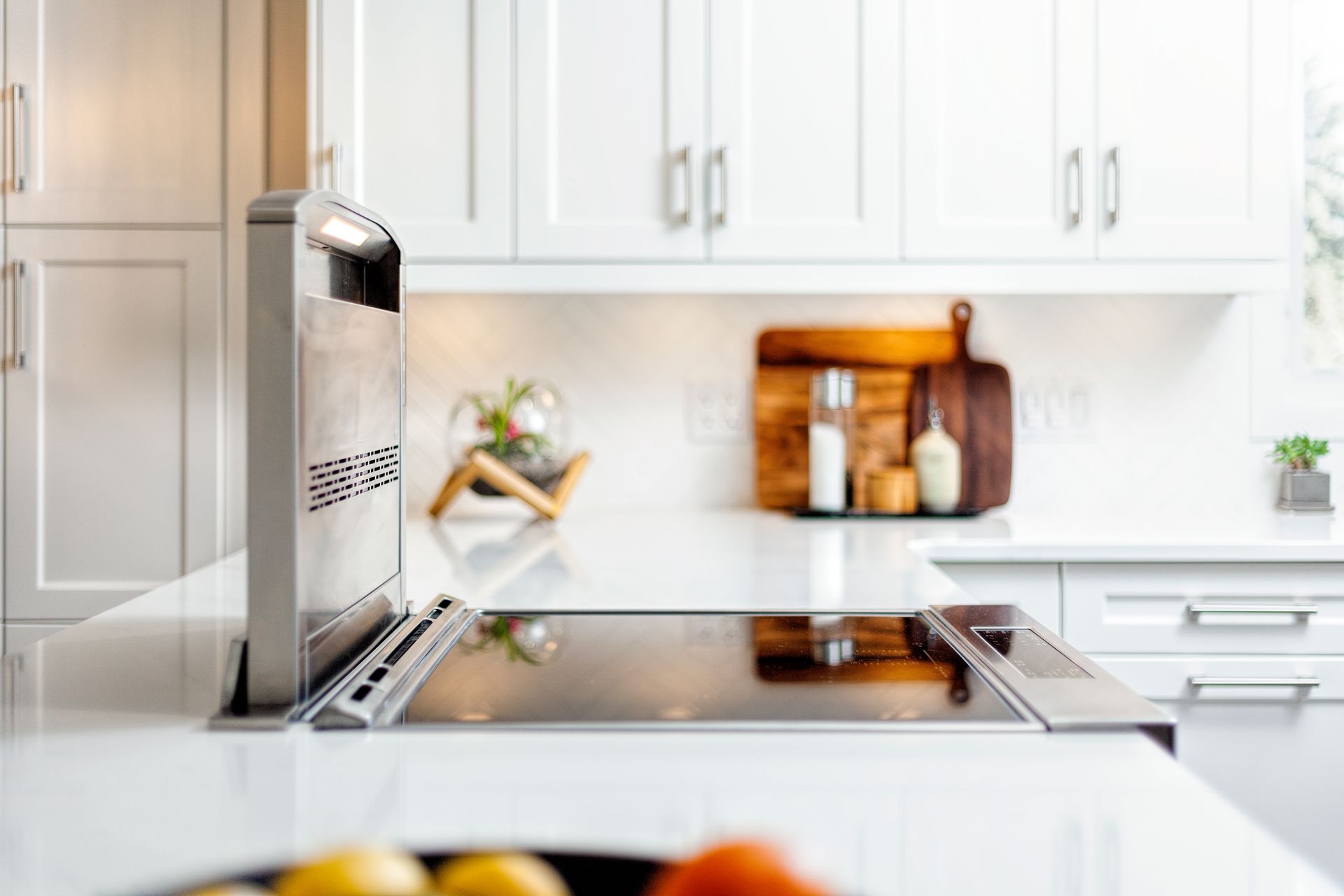 a kitchen with white cabinets and a stove top oven .