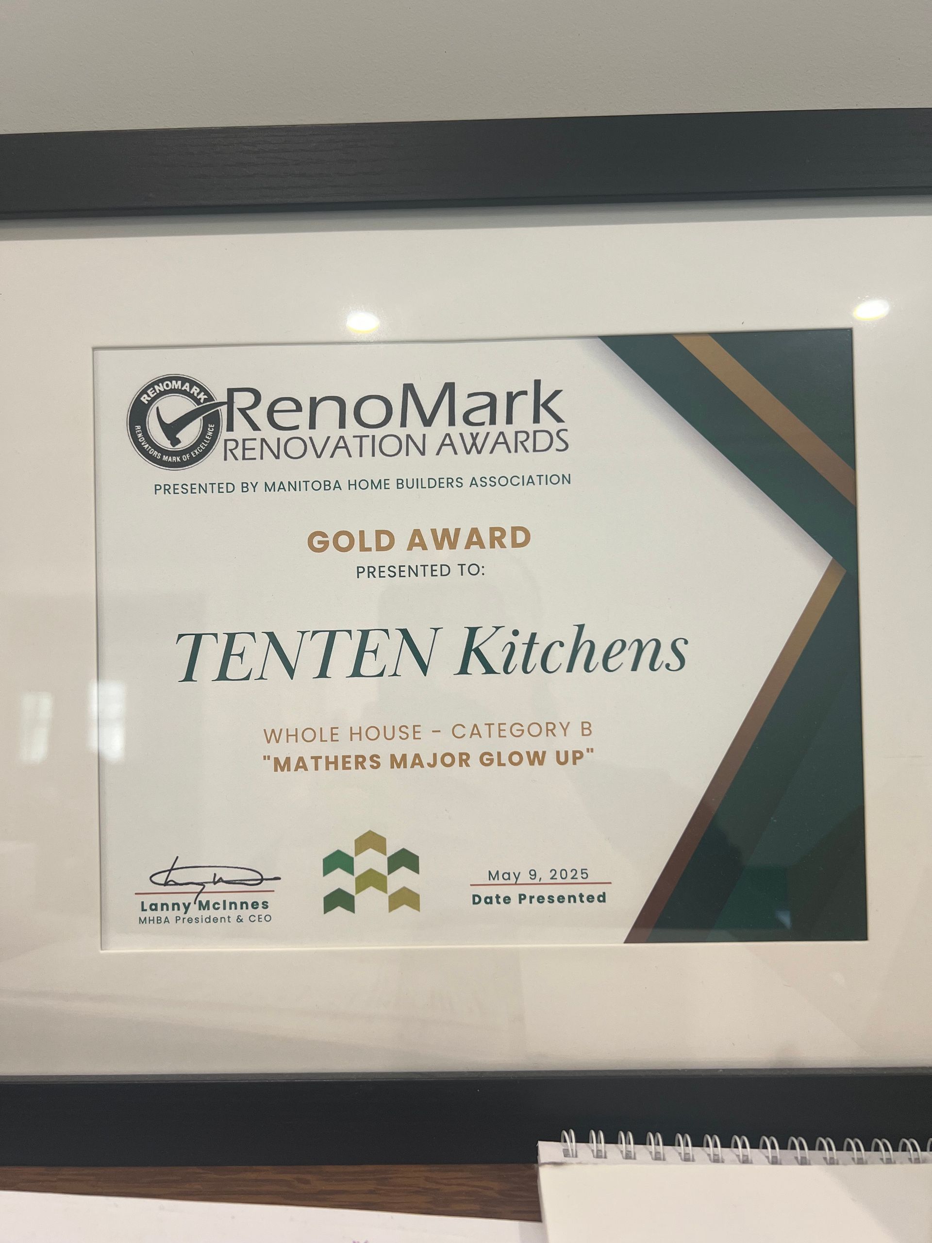 A framed RenoMark Gold Award certificate for TENTEN Kitchens, recognizing the project