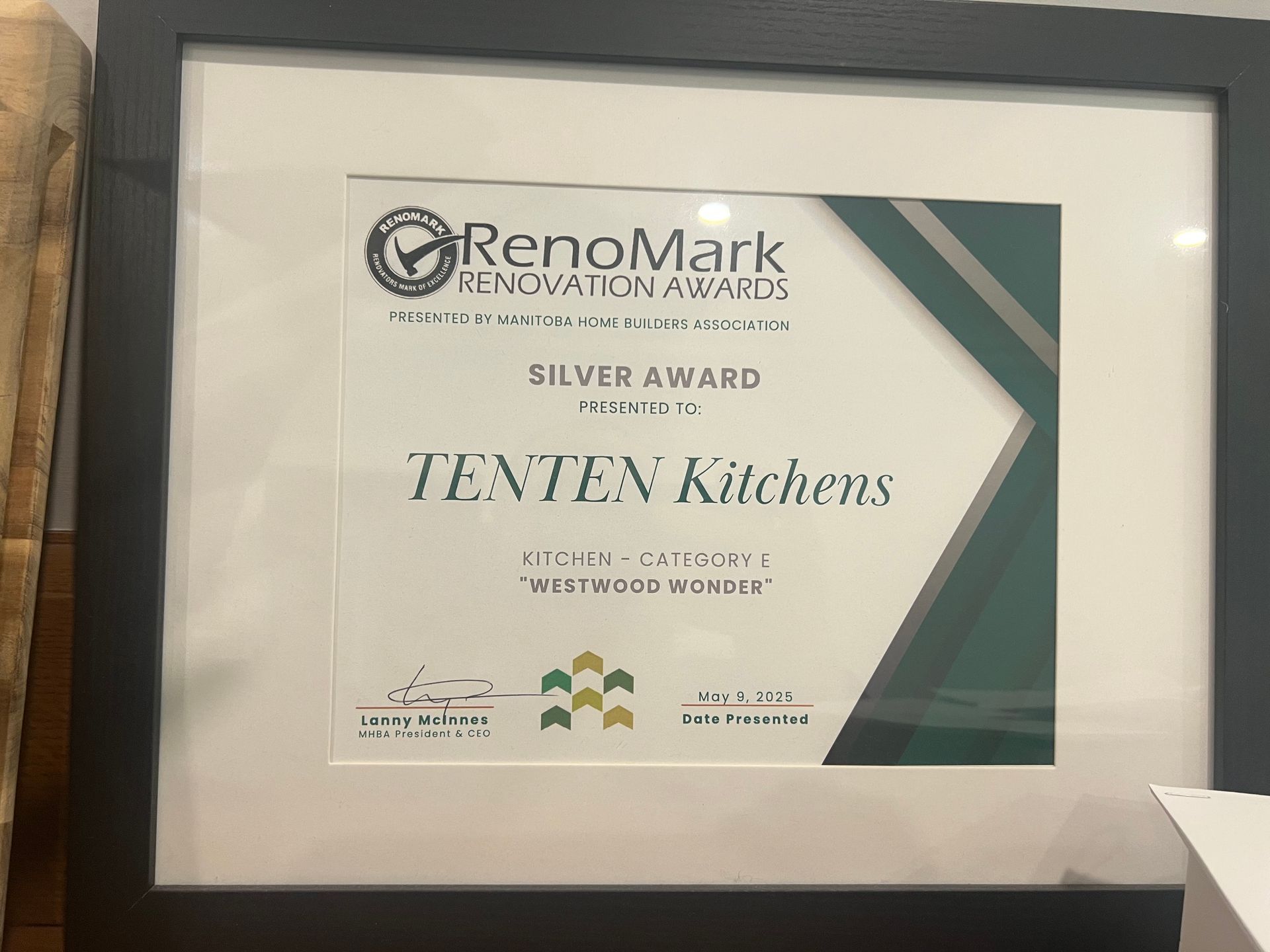 A framed RenoMark Renovation Awards Silver Award for TENTEN Kitchens, presented by the Winnipeg Home Builders Association.