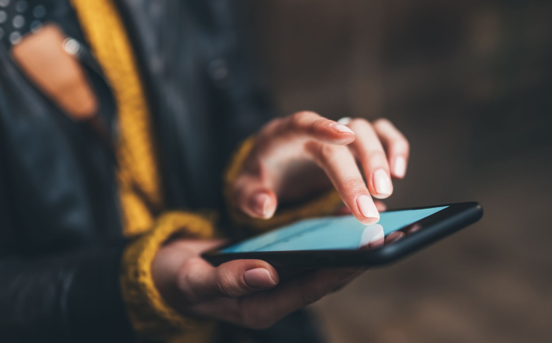 Stock photo of a person using a phone
