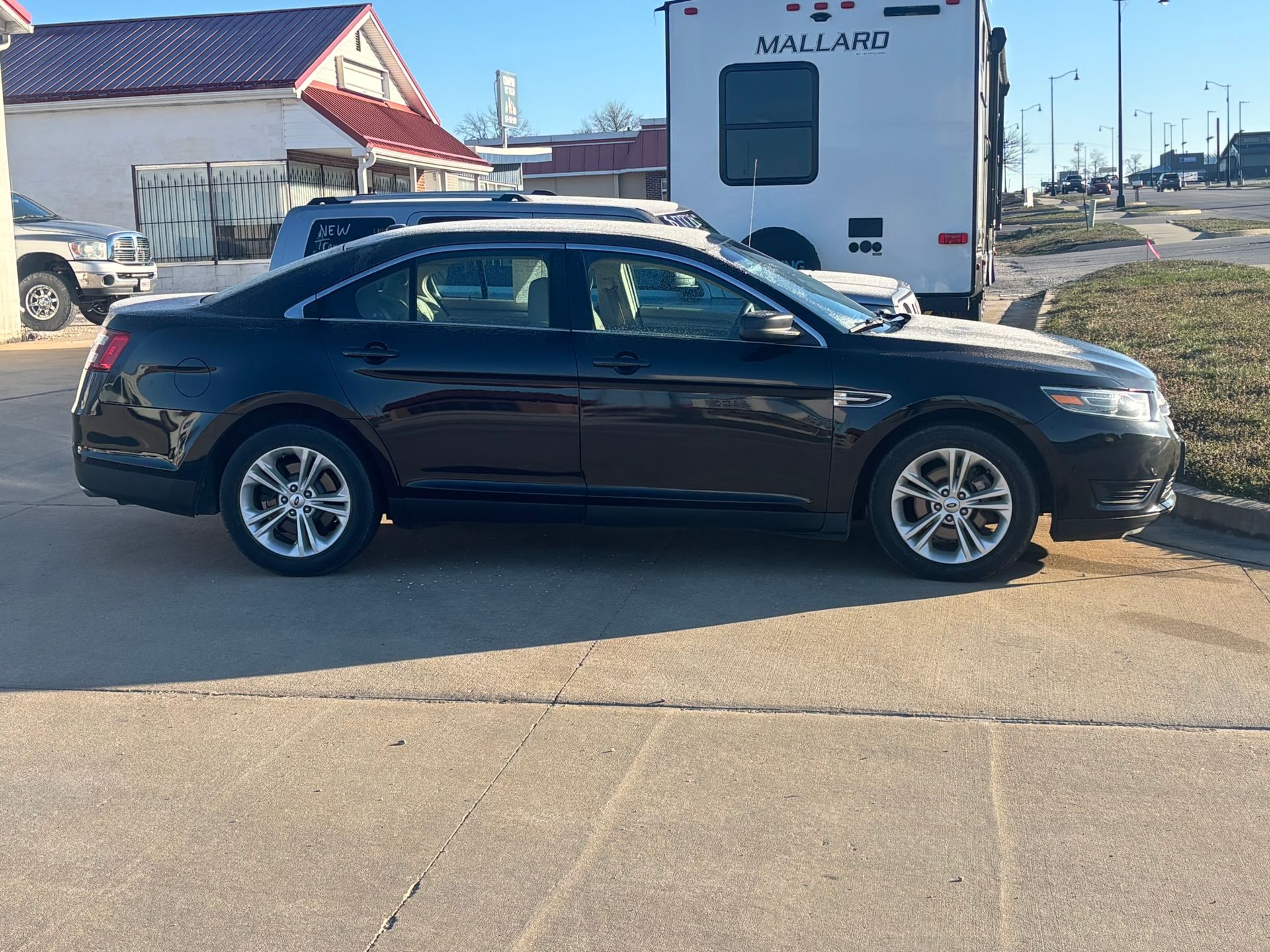 A flyer for a 2018 black Ford Taurus