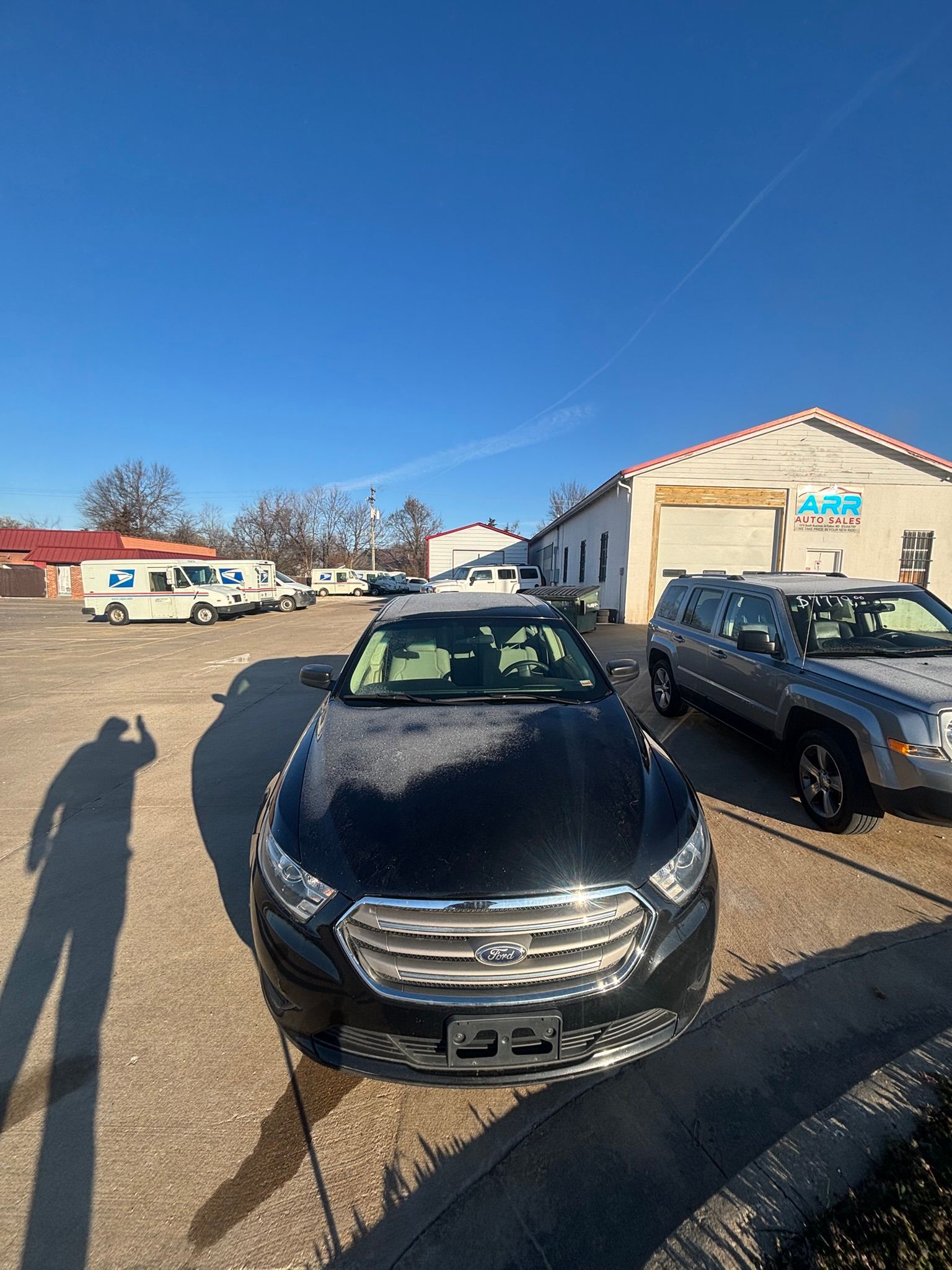 A flyer for a 2018 black Ford Taurus