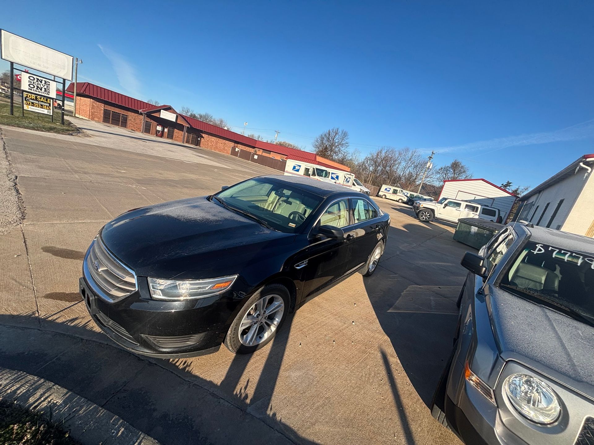 A flyer for a 2018 black Ford Taurus