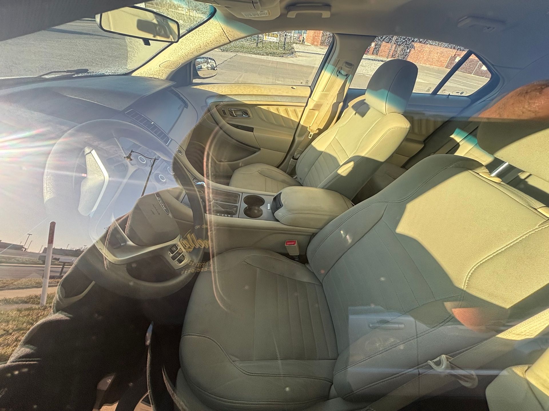 A flyer for a 2018 black Ford Taurus