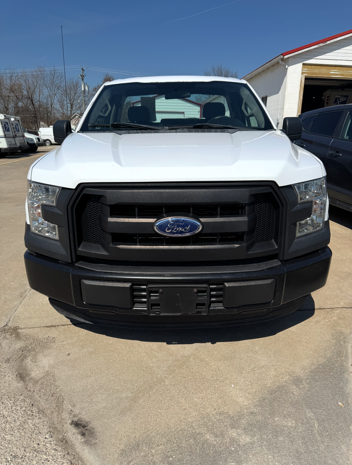 A 2016 white Ford F150 truck