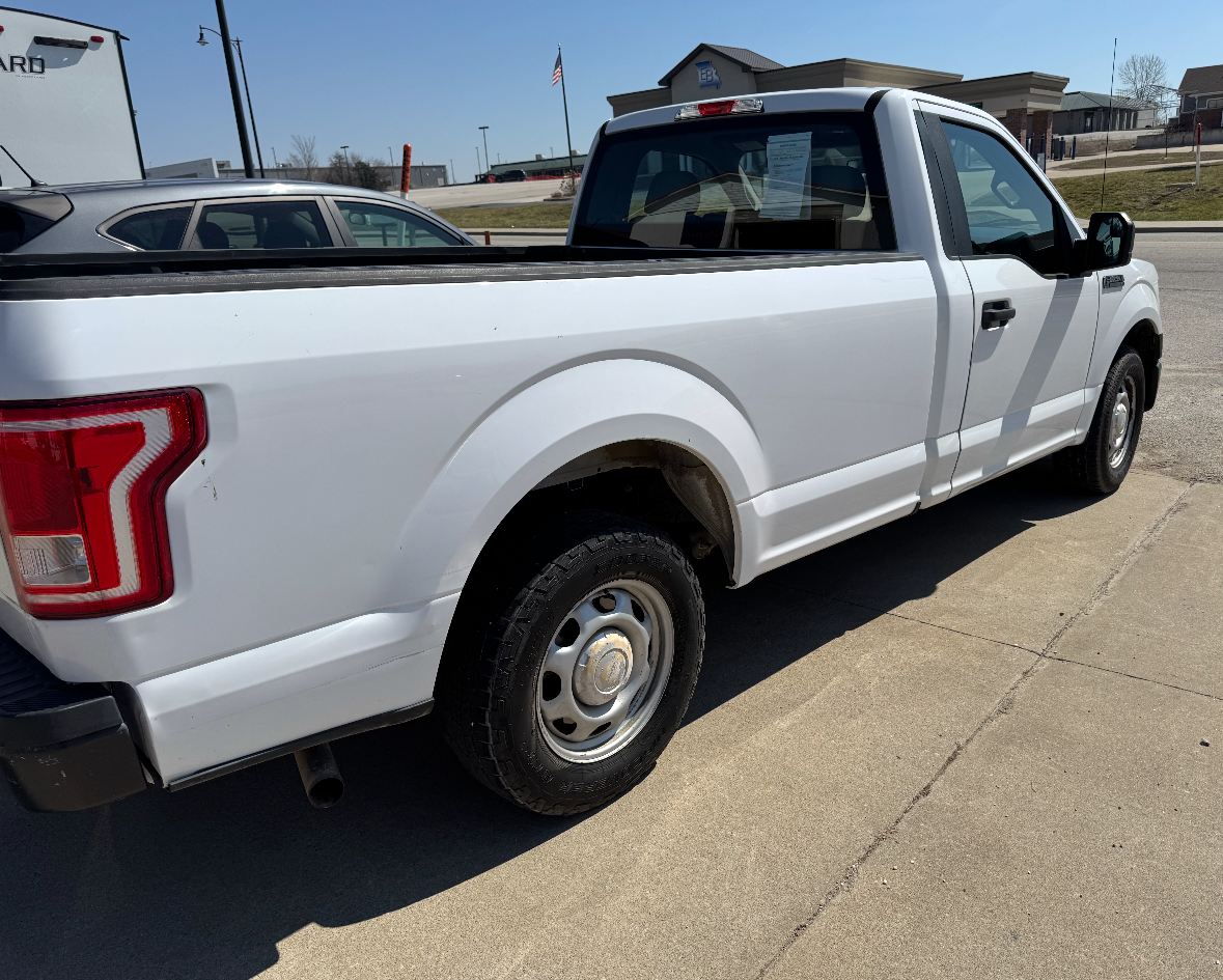 A 2016 white Ford F150 truck