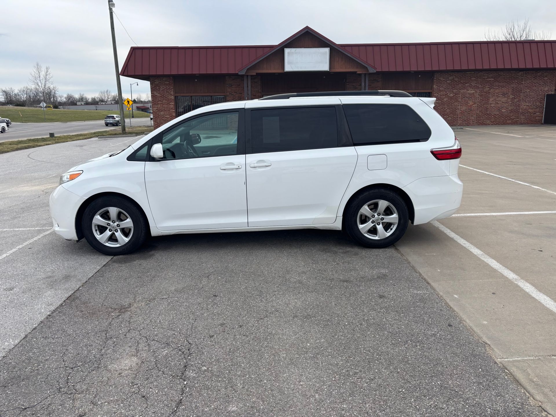 A white 2016 Toyota Sienna van