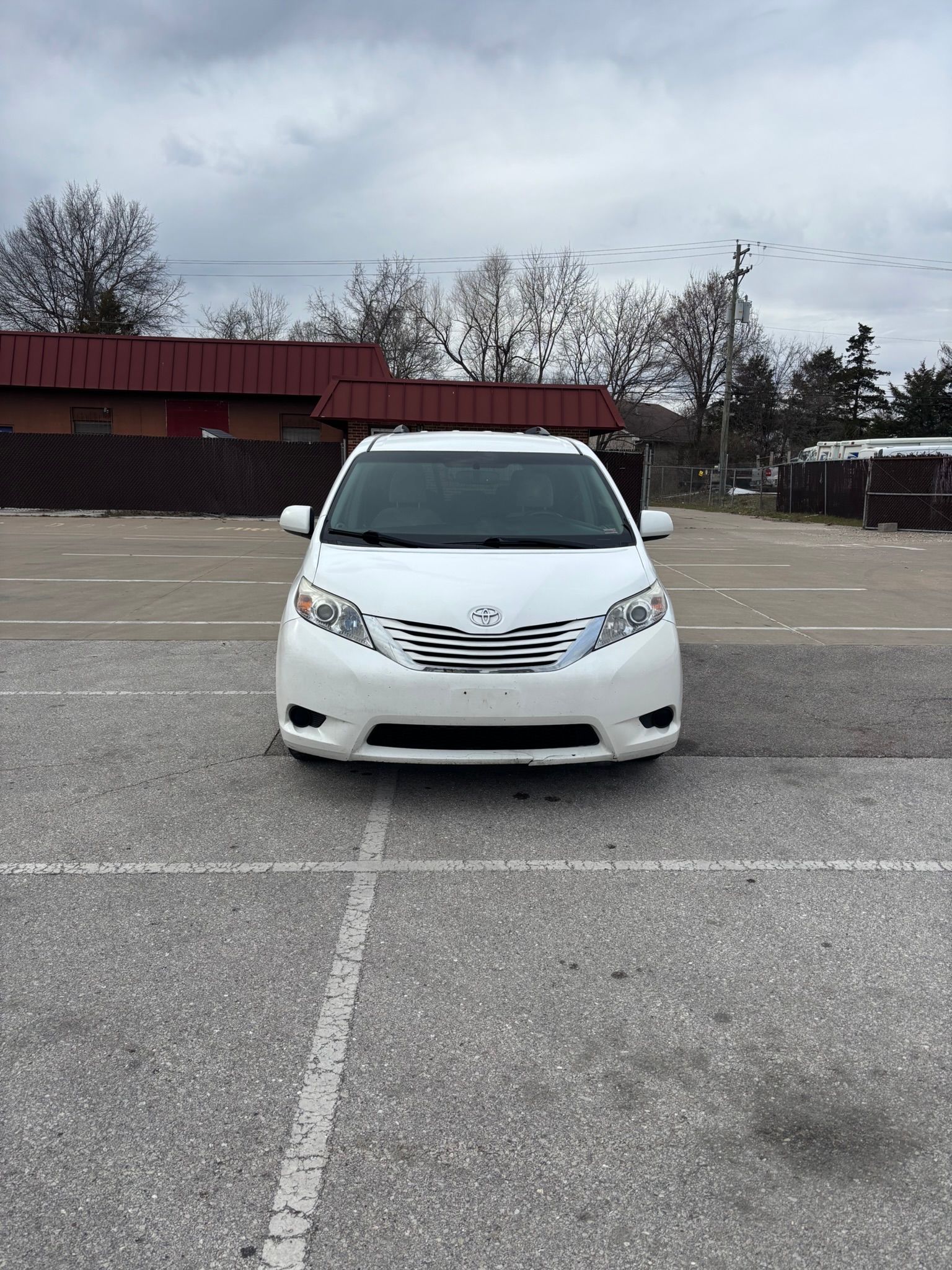 A white 2016 Toyota Sienna van