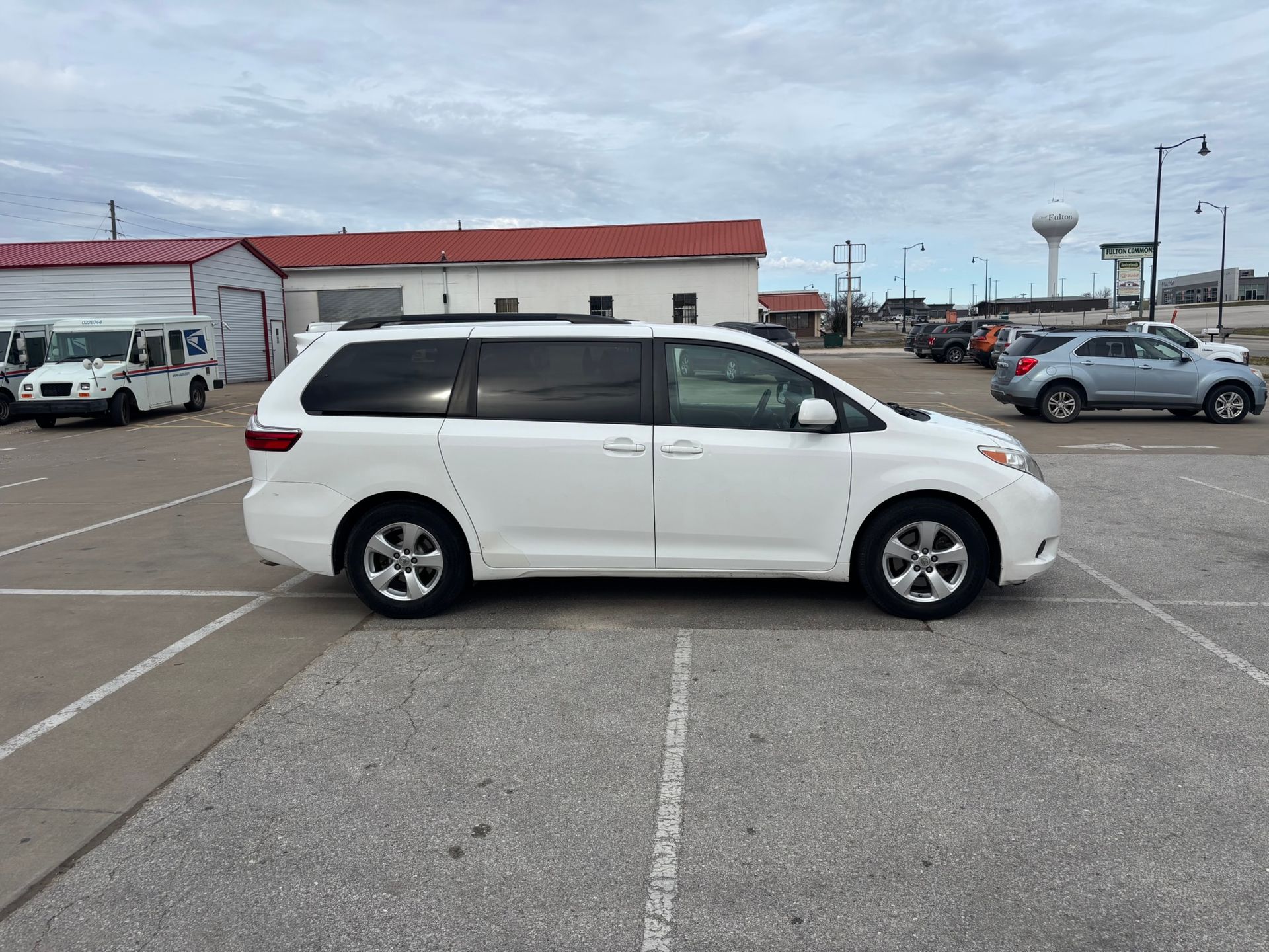 A white 2016 Toyota Sienna van