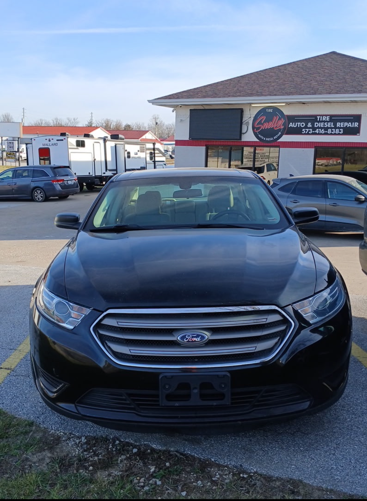 A flyer for a 2018 black Ford Taurus