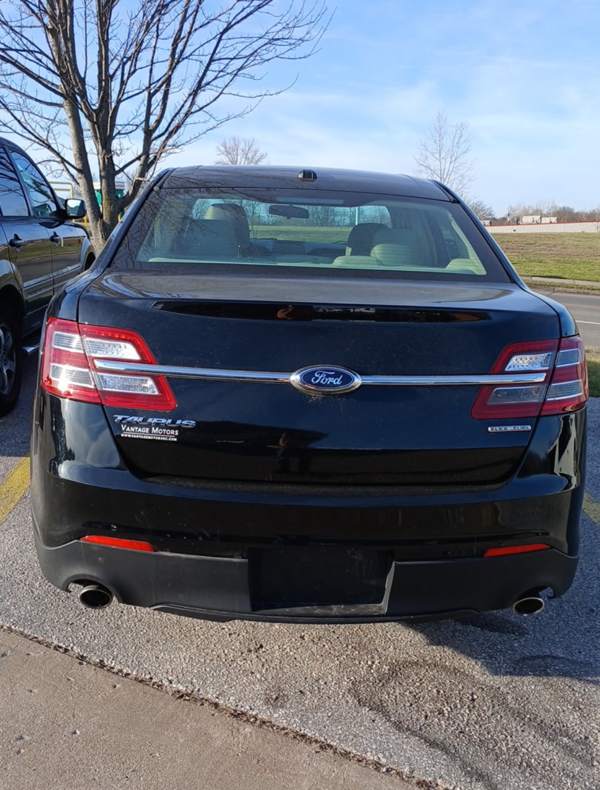 A flyer for a 2018 black Ford Taurus