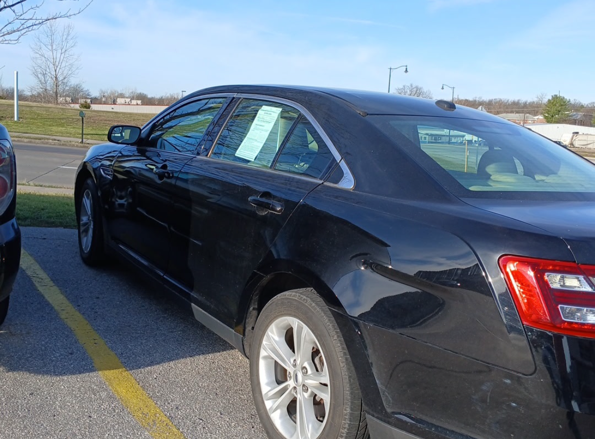 A flyer for a 2018 black Ford Taurus