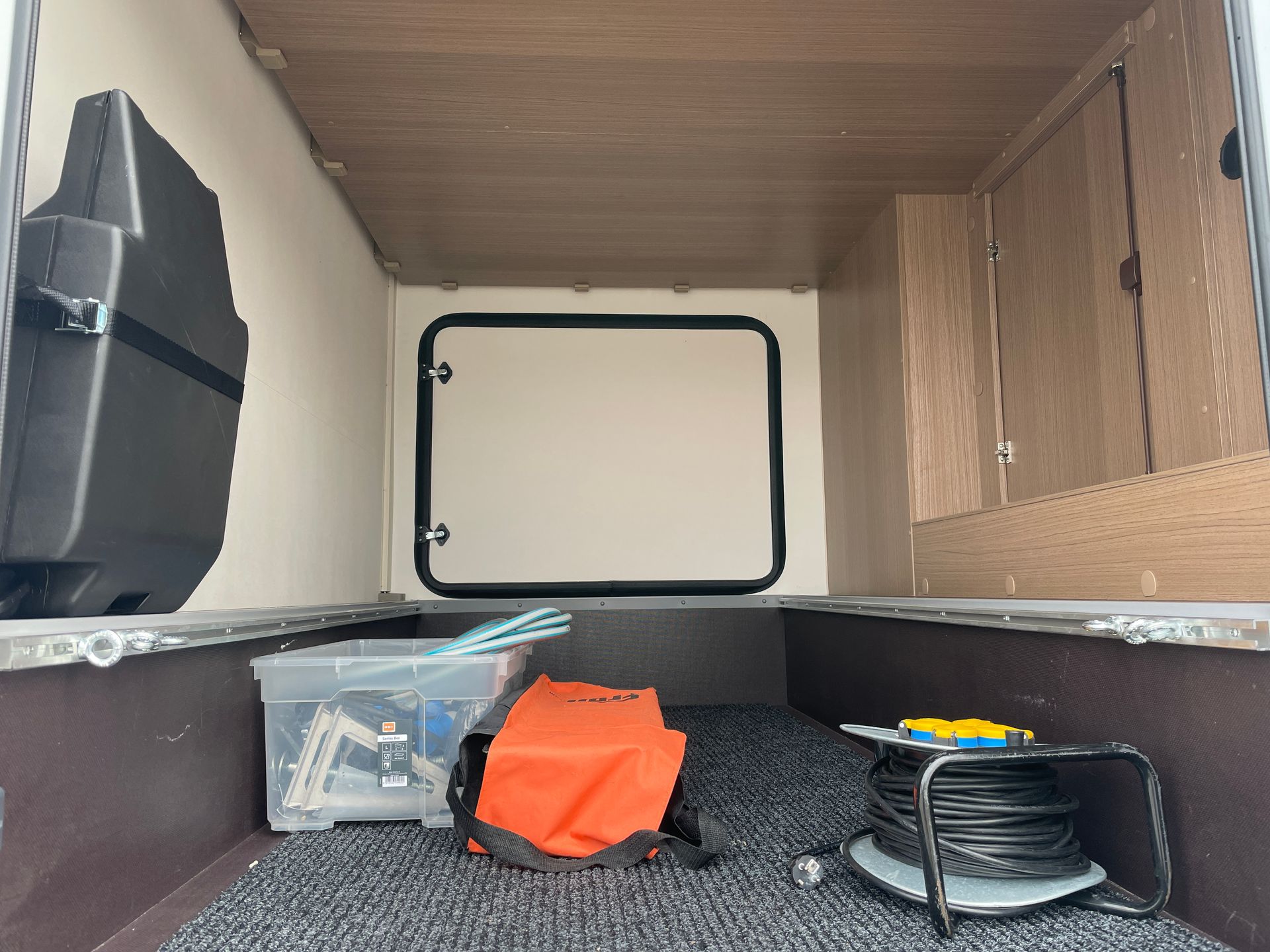 The inside of a trailer with a lot of storage space