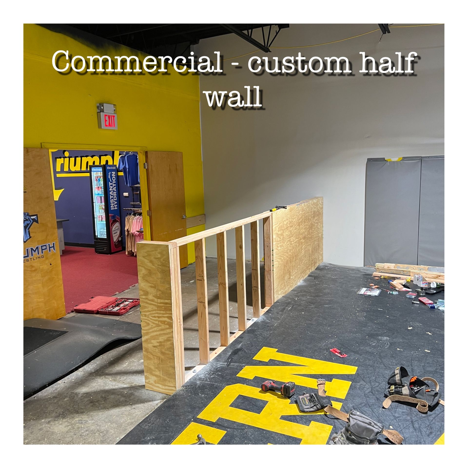 A picture of a commercial custom half wall being built