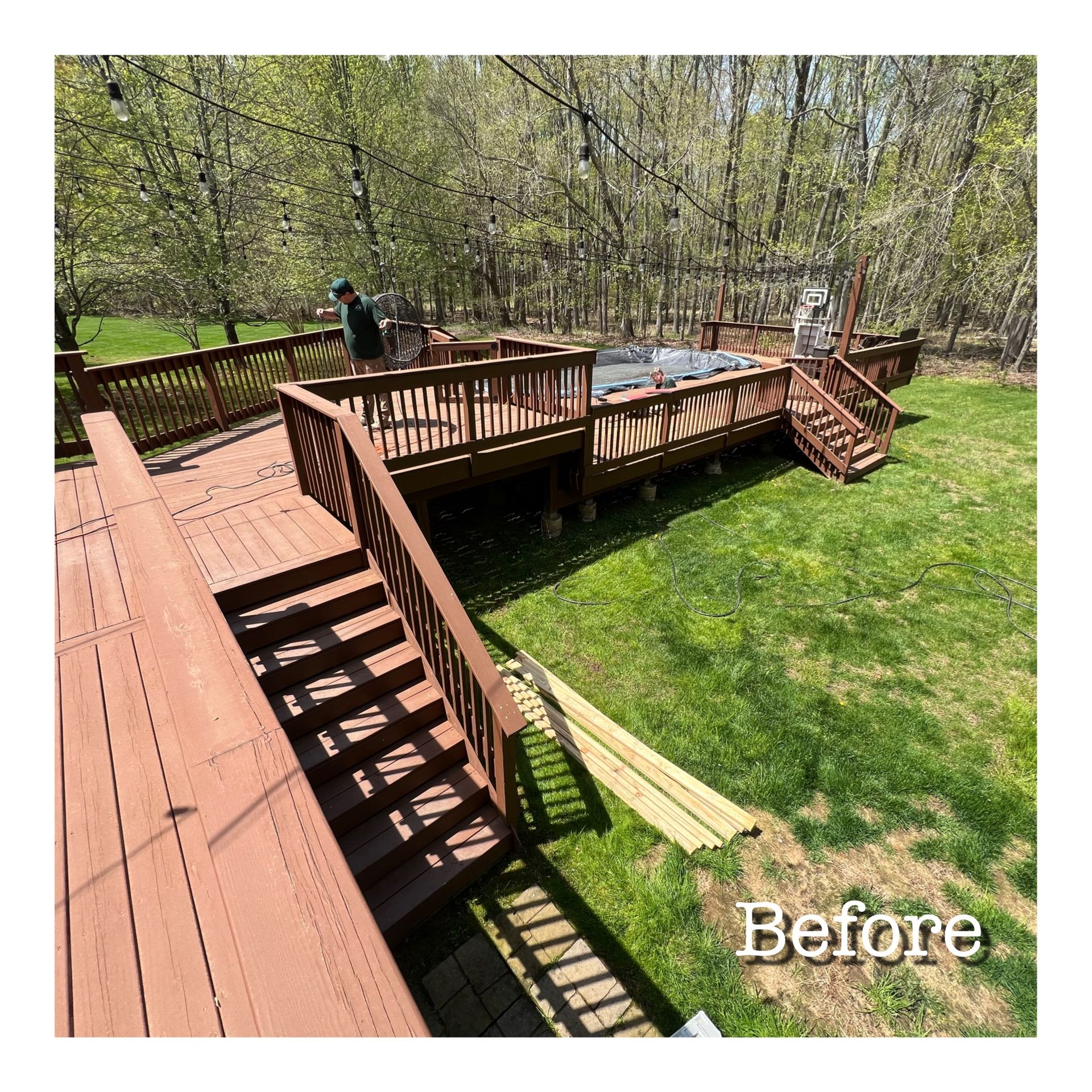 A before picture of a wooden deck with stairs and a hot tub.