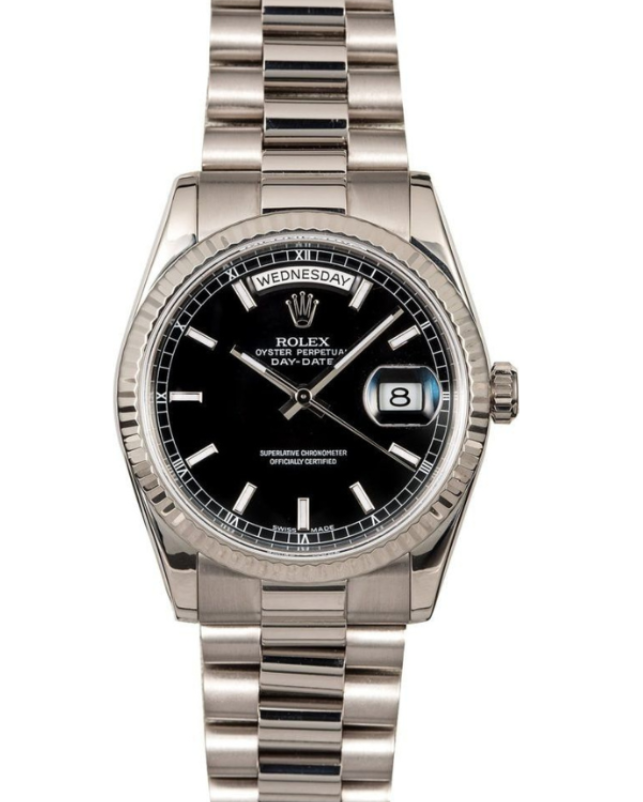 Silver Rolex watch with black dial and date display on a metal bracelet