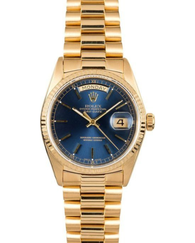 Gold Rolex watch with blue dial and date window on a gold bracelet