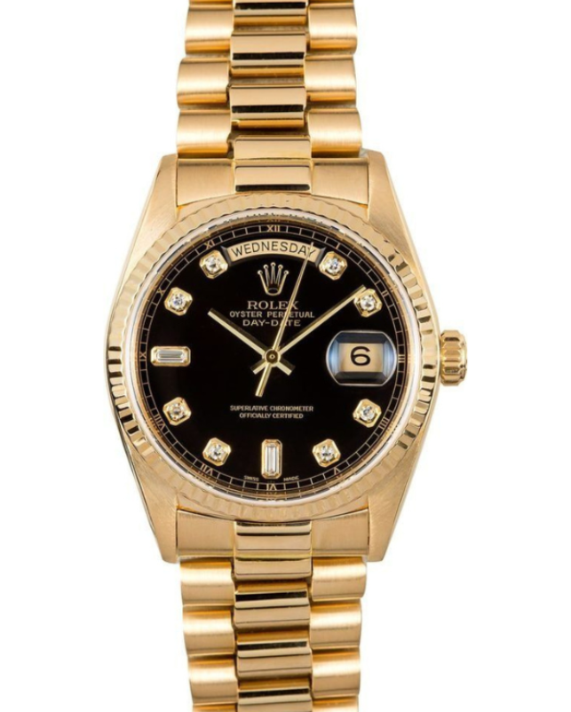 Gold wristwatch with black dial and date window