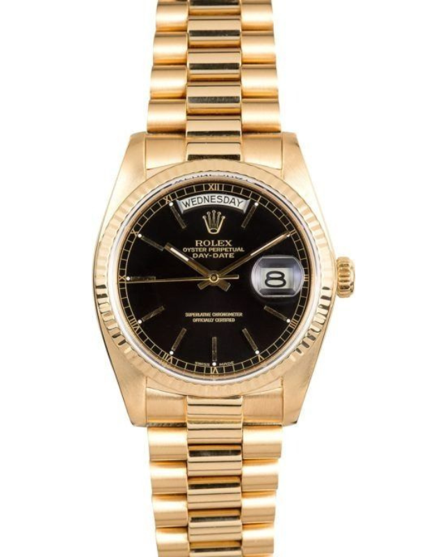 Gold Rolex wristwatch with black dial and date window on a gold metal band