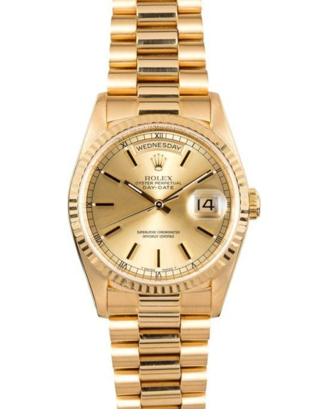 Gold Rolex wristwatch with date display and two-tone metal band on a white background