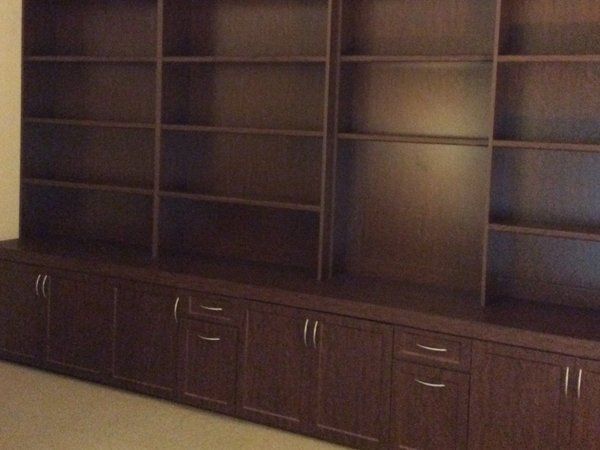 A room with a lot of shelves and cabinets