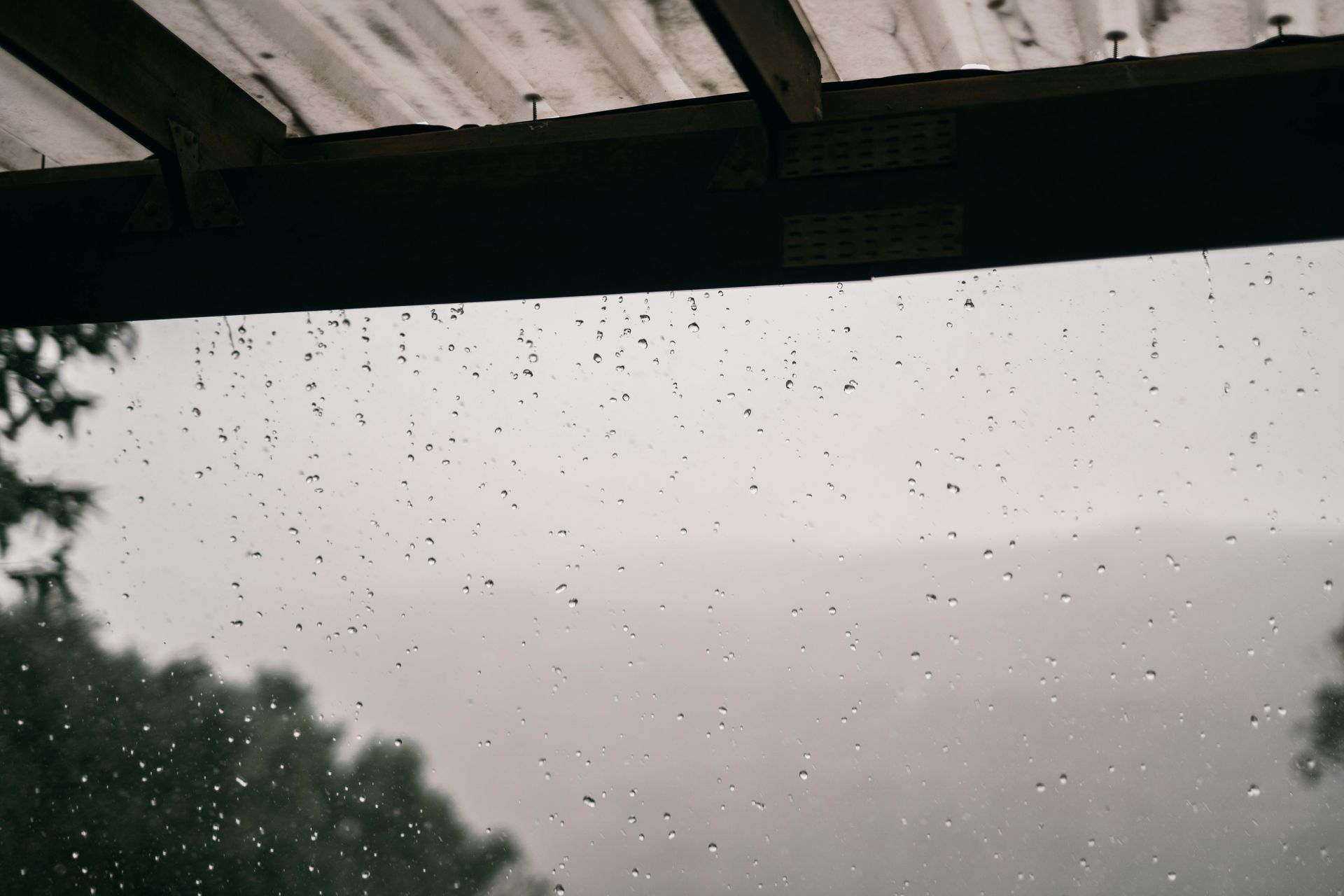Rain is pouring down and is leaking through the roof