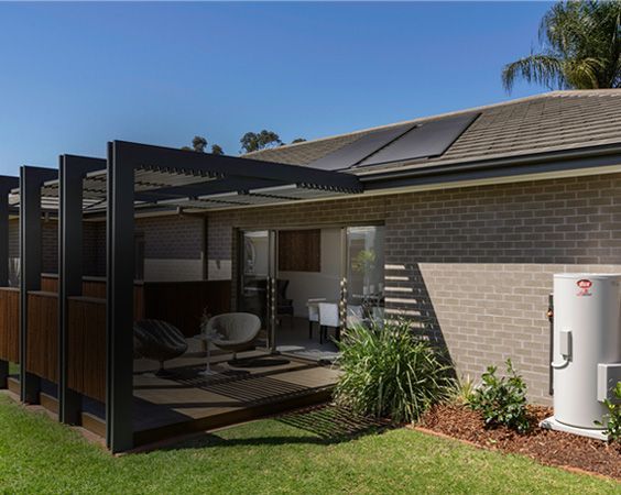 Modern House Patio With Black Pergola — Forster Hotwater in Forster, NSW