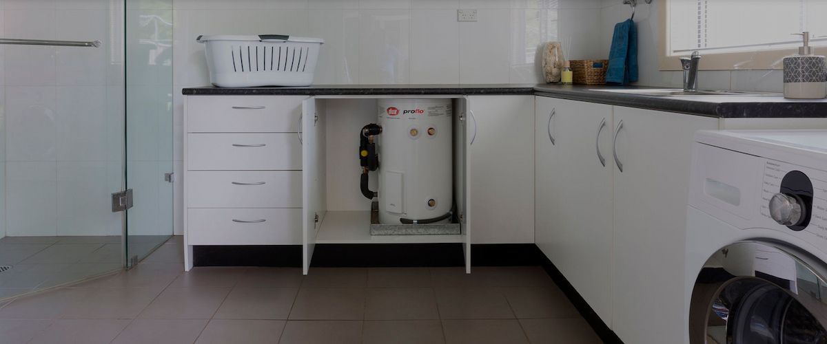 Kitchen With White Cabinets, Open Sink Cabinet and Countertop — Forster Hotwater in Nabiac, NSW