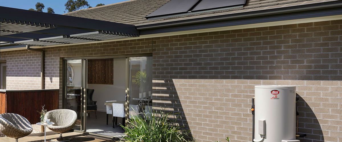 Suburban House Exterior With Brick Walls — Forster Hotwater in Nabiac, NSW