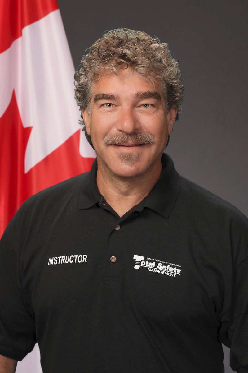 A man wearing a black shirt with the word instructor on it