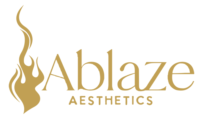 Gold logo featuring a stylized flame graphic to the left of the text "Ablaze AESTHETICS" in a serif font.
