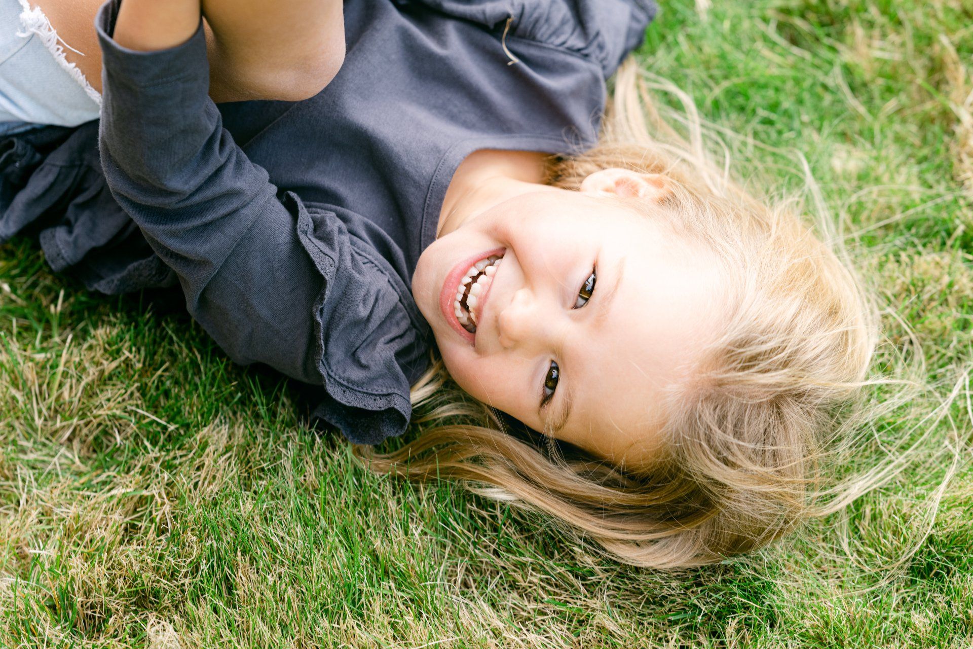 small blonde girl smiling