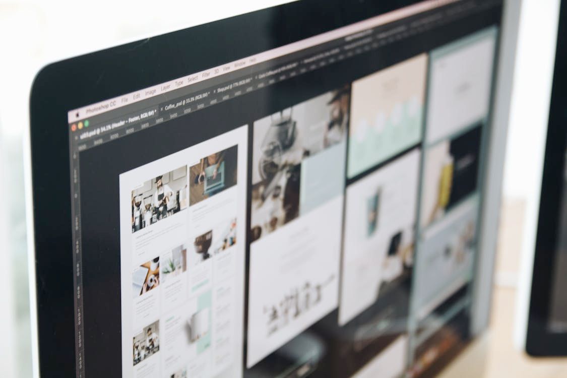 Computer screen displaying a grid of website design ideas in varying shades of white, beige, and green.
